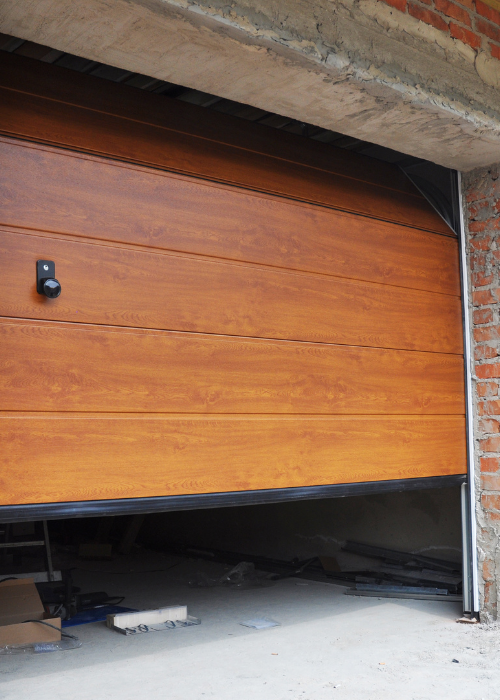 Replacing the battery in a garage door remote control. - Bedfordview Garage Door Repairs | Your Garage Door Guy Replacing the battery in a garage door remote control.