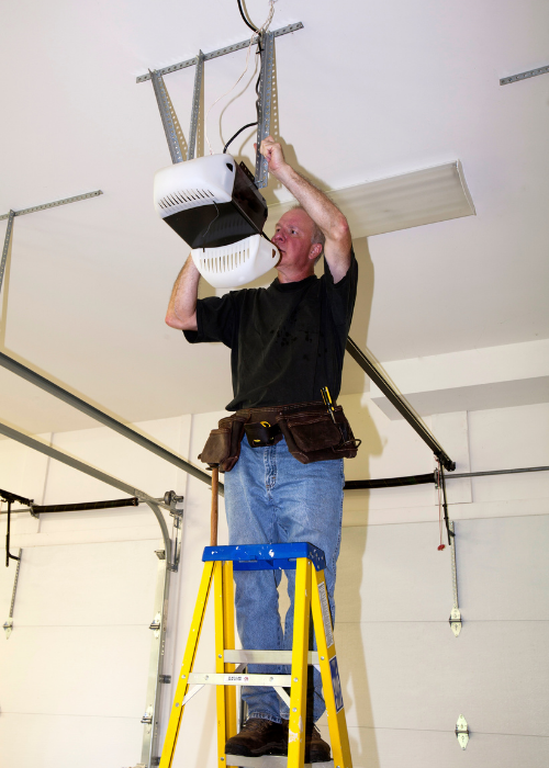 Universal garage door receiver being wired for better range. - Bedfordview Garage Door Repairs | Your Garage Door Guy Universal garage door receiver being wired for better range.