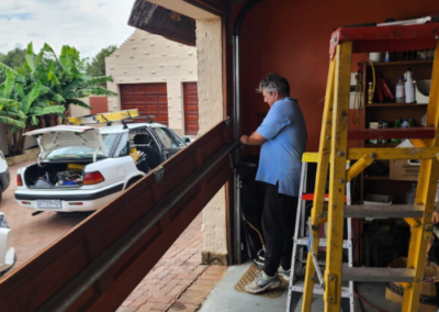 Quiet-drive garage door motor being serviced in Isando. - Bedfordview Garage Door Repairs | Your Garage Door Guy Quiet-drive garage door motor being serviced in Isando.