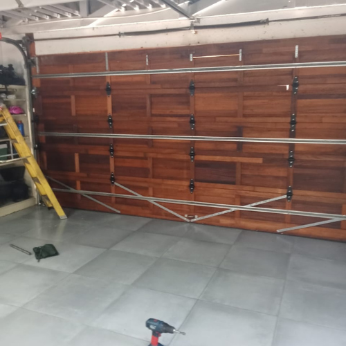 Untitled design (56) Stylish wood-look garage door installation in Greenstone.